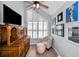 Cozy sitting area with a large window, shutter details and classic furnishings at 14723 Seminole Trl, Seminole, FL 33776