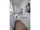 Stylish stairway with wood treads and white risers leading to the main living area at 14723 Seminole Trl, Seminole, FL 33776