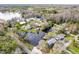 Aerial view of a home with a private dock and waterfront access, showcasing its prime location on the water at 18914 5Th St, Lutz, FL 33548