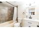 Bathroom with updated sink and tiled shower at 18914 5Th St, Lutz, FL 33548