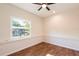 Bright bedroom with wood flooring and a view of the lake at 18914 5Th St, Lutz, FL 33548