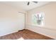Bright bedroom with wood flooring and a large window at 18914 5Th St, Lutz, FL 33548