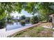 Waterfront property with private dock and covered boat lift offering scenic views and convenient water access at 18914 5Th St, Lutz, FL 33548