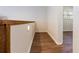Hallway with wood flooring and a view of the outdoors at 18914 5Th St, Lutz, FL 33548