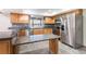 Modern kitchen showcases stainless steel appliances, granite countertops, and ample cabinet space at 18914 5Th St, Lutz, FL 33548