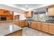 Well-equipped kitchen with granite countertops and stainless steel dishwasher next to a window at 18914 5Th St, Lutz, FL 33548