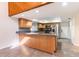 Bright kitchen boasts a wood beam accent, recessed lighting, and stainless steel appliances at 18914 5Th St, Lutz, FL 33548