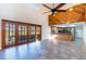 Open floor plan with hardwood floors, a view of the kitchen, patio and an eating area at 18914 5Th St, Lutz, FL 33548