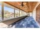 Enclosed porch with views of the water, a wood ceiling, and modern tile flooring at 18914 5Th St, Lutz, FL 33548