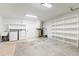 Spacious utility room with a laundry area and open shelving at 18914 5Th St, Lutz, FL 33548