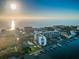 Scenic aerial view of waterfront condos, tennis courts and boat docks at 19111 Vista Bay Dr # 304, Indian Shores, FL 33785