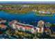 An expansive view of the building surrounded by water with access to the docks and tennis courts at 19111 Vista Bay Dr # 304, Indian Shores, FL 33785