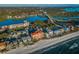 Wide aerial view of the residential building with beach access, waterfront views, and surrounding neighborhood at 19111 Vista Bay Dr # 304, Indian Shores, FL 33785