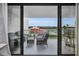 Enjoy the views from the comfortable balcony with seating and pool views at 19111 Vista Bay Dr # 304, Indian Shores, FL 33785