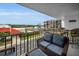 Inviting balcony featuring comfortable seating and views of the waterfront and surrounding community at 19111 Vista Bay Dr # 304, Indian Shores, FL 33785
