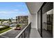 Balcony view showcasing parking and nearby waterfront complex and beautiful skies at 19111 Vista Bay Dr # 304, Indian Shores, FL 33785