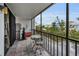 Enclosed balcony showcasing exercise equipment and small bistro seating area at 19111 Vista Bay Dr # 304, Indian Shores, FL 33785