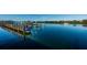Picturesque boat dock with lift offers serene water views and secure storage for your vessel at 19111 Vista Bay Dr # 304, Indian Shores, FL 33785