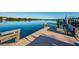 Beautiful dock overlooking the calm waters with boat access and tranquil views of the surrounding nature at 19111 Vista Bay Dr # 304, Indian Shores, FL 33785
