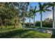 Scenic driveway leading to the property, lined with lush greenery and mature trees at 19111 Vista Bay Dr # 304, Indian Shores, FL 33785
