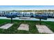 Outdoor grill area for residents to enjoy with well-maintained grassy area at 19111 Vista Bay Dr # 304, Indian Shores, FL 33785