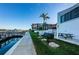 Grill and picnic area by the water, perfect for outdoor entertaining with waterfront view at 19111 Vista Bay Dr # 304, Indian Shores, FL 33785