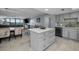 Contemporary kitchen design with quartz countertops, modern cabinetry, and an island for extra storage at 19111 Vista Bay Dr # 304, Indian Shores, FL 33785