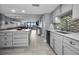 Modern kitchen featuring sleek countertops, stainless steel appliances, and stylish backsplash at 19111 Vista Bay Dr # 304, Indian Shores, FL 33785