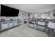 Open-concept living room with a comfortable leather sofa and modern entertainment center for relaxing at 19111 Vista Bay Dr # 304, Indian Shores, FL 33785