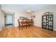 Dining area featuring a wood table with seating for six, ceiling fan, and open to the kitchen at 19531 Gulf Blvd # 205, Indian Shores, FL 33785