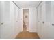 Hallway with closet, leading to bathroom at 19531 Gulf Blvd # 205, Indian Shores, FL 33785