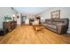 Open-concept living area with dining table, sliding doors to balcony, and comfortable seating area at 19531 Gulf Blvd # 205, Indian Shores, FL 33785