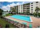 Enjoy the large community pool with plenty of lounge chairs and beautiful landscaping at 19531 Gulf Blvd # 205, Indian Shores, FL 33785