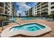 Community pool and spa area with plenty of space to relax and enjoy the Florida sunshine at 19531 Gulf Blvd # 205, Indian Shores, FL 33785