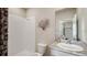 Bathroom featuring granite countertop, modern sink, and walk-in shower with decorative shower curtain at 19695 Gladeview Way, Land O Lakes, FL 34638