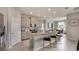 Modern kitchen features stainless steel appliances, granite countertops, ample cabinet space, and an island with seating at 19695 Gladeview Way, Land O Lakes, FL 34638
