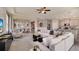 Spacious open-concept living area with seamless flow to the dining and kitchen, perfect for modern living at 19695 Gladeview Way, Land O Lakes, FL 34638