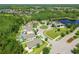Homes line the cul-de-sac in this community with mature trees, ponds, and well-kept lawns at 21627 Pearl Crescent Ct, Land O Lakes, FL 34637