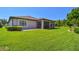 Sprawling backyard with well-maintained lawn and mature landscaping, and screened in porch, ideal for outdoor enjoyment at 21627 Pearl Crescent Ct, Land O Lakes, FL 34637