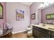 Bathroom features tile floors, artwork, vanity with sink, and a toilet at 21627 Pearl Crescent Ct, Land O Lakes, FL 34637