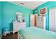 This bedroom features light blue walls, wood floors, and white trim at 21627 Pearl Crescent Ct, Land O Lakes, FL 34637