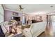 Bright and airy living room showcasing wood floors, comfortable seating, and an inviting open layout at 21627 Pearl Crescent Ct, Land O Lakes, FL 34637
