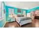 Inviting main bedroom showcasing bright walls, comfortable furnishings, and lots of natural light at 21627 Pearl Crescent Ct, Land O Lakes, FL 34637