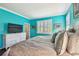Spacious main bedroom with plantation shutters, allowing ample natural light, and wood-look floors at 21627 Pearl Crescent Ct, Land O Lakes, FL 34637