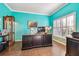 Bright office with blue walls, shutters on windows, a large desk, and tile floors at 21627 Pearl Crescent Ct, Land O Lakes, FL 34637