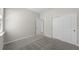 Comfortable bedroom featuring soft carpeting and a closet for storage at 2731 Winding Creek Trl, North Port, FL 34289