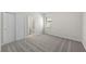 Bedroom with soft carpeting, closet and a window for natural light at 2731 Winding Creek Trl, North Port, FL 34289