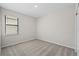 Comfortable bedroom with window offering natural light and soft carpeting at 2731 Winding Creek Trl, North Port, FL 34289