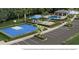 Aerial view of the community amenities including a pool, playground, and basketball court at 2731 Winding Creek Trl, North Port, FL 34289