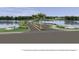 Scenic community entrance with lakes, palm trees, and decorative landscaping at 2731 Winding Creek Trl, North Port, FL 34289
